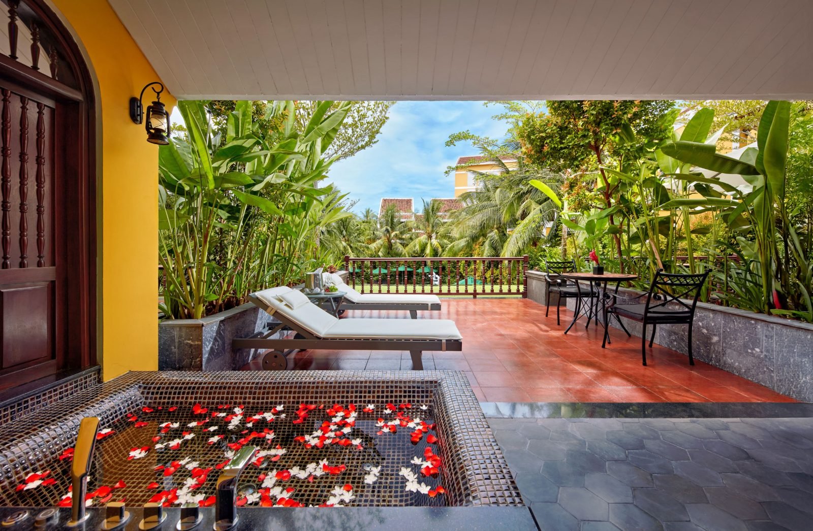 Private terrace with plunge pool surrounded by greenery